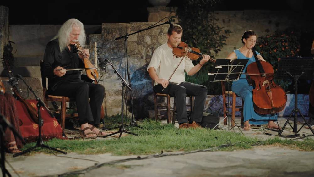 Experience the Ross Daly Ensemble's captivating performance at the Labyrinth Musical Workshop Summer 2021 in Crete, blending Cretan and modal music traditions.